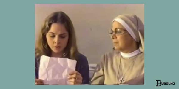 Resumo-de-As-meninas-há-uma-menina-morena-lendo-uma-carta-com-uma-freira-ao-lado-olhando-para-o-papel